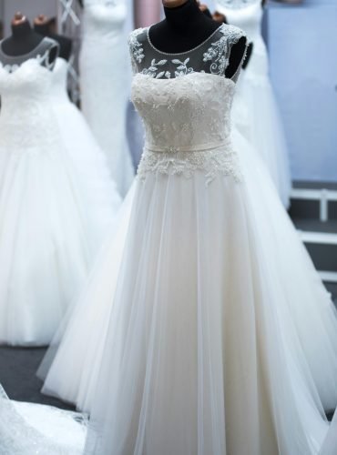 Showcasing elegant wedding dresses on mannequins, perfect for bridal fashion shows.